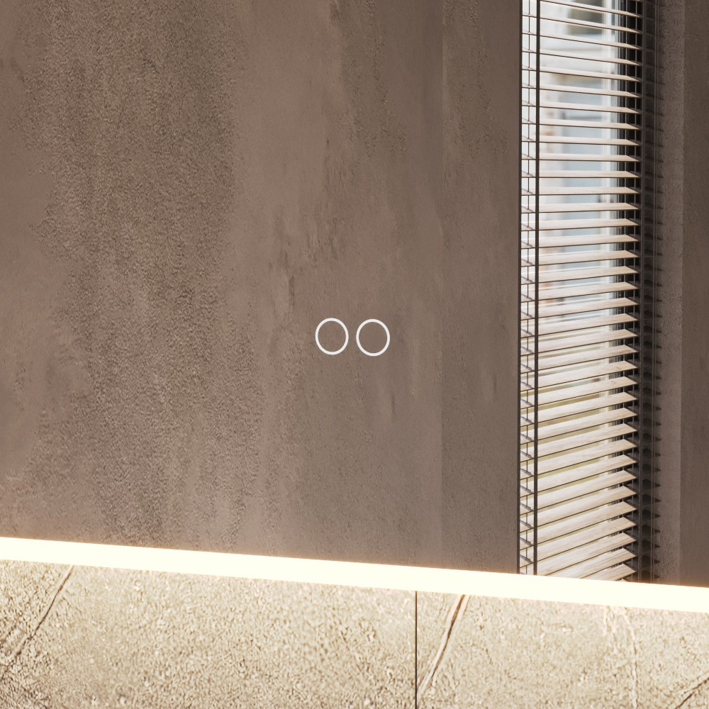 Uitgevoerd met een dubbele touch schakelaar in het spiegelglas; linker touch knop voor het gelijktijdig in- en uitschakelen van de verlichting en de verwarming, inclusief geïntegreerde dimfunctie voor de verlichting, rechter touch knop om traploos de gewenste kleur van de verlichting in te stellen